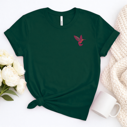 Pink hummingbird embroidered tee for women featuring a single detailed hummingbird on the left chest, a minimalist bird lover shirt perfect for nature lovers, gardeners, bird watchers, spring outfits, casual wear and thoughtful hummingbird lover gifts
