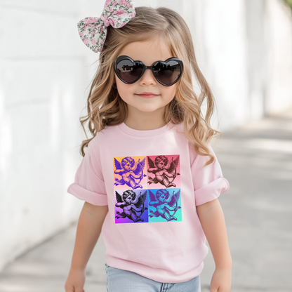 The Pop Art Cupid Toddler T-shirt, available in sizes 2T-5T, combines a bold, vintage Cupid graphic with soft, comfortable fabric. Available in Black, White, and Pink, this stylish tee is perfect for toddlers who love retro-inspired fashion and playful designs. Whether it’s for casual everyday wear or family matching outfits, this artsy t-shirt captures the fun of pop culture while keeping little ones comfortable and looking cute.
