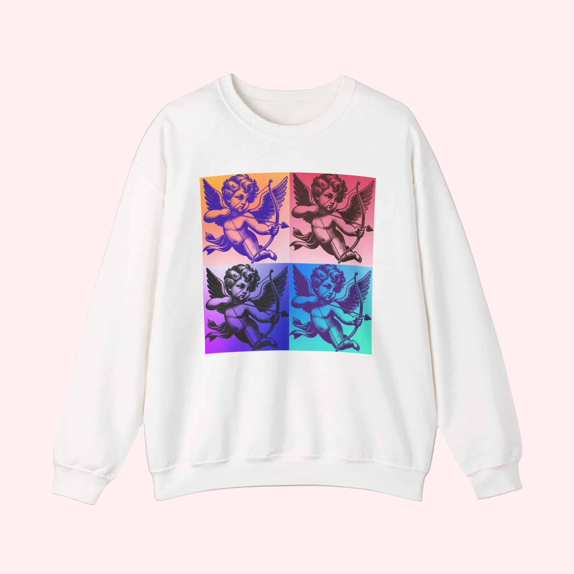 Flatlay image of a white pop art cupid sweatshirt laid out to showcase the colorful four square angel design. Printed on a soft and durable Gildan 18000 crewneck, this graphic sweatshirt is available in black and white and offers inclusive sizing from Small to 5XL. Also available in child sizes and as a t shirt, making it ideal for Mommy and Me outfits, family matching looks, and Valentine themed apparel.
