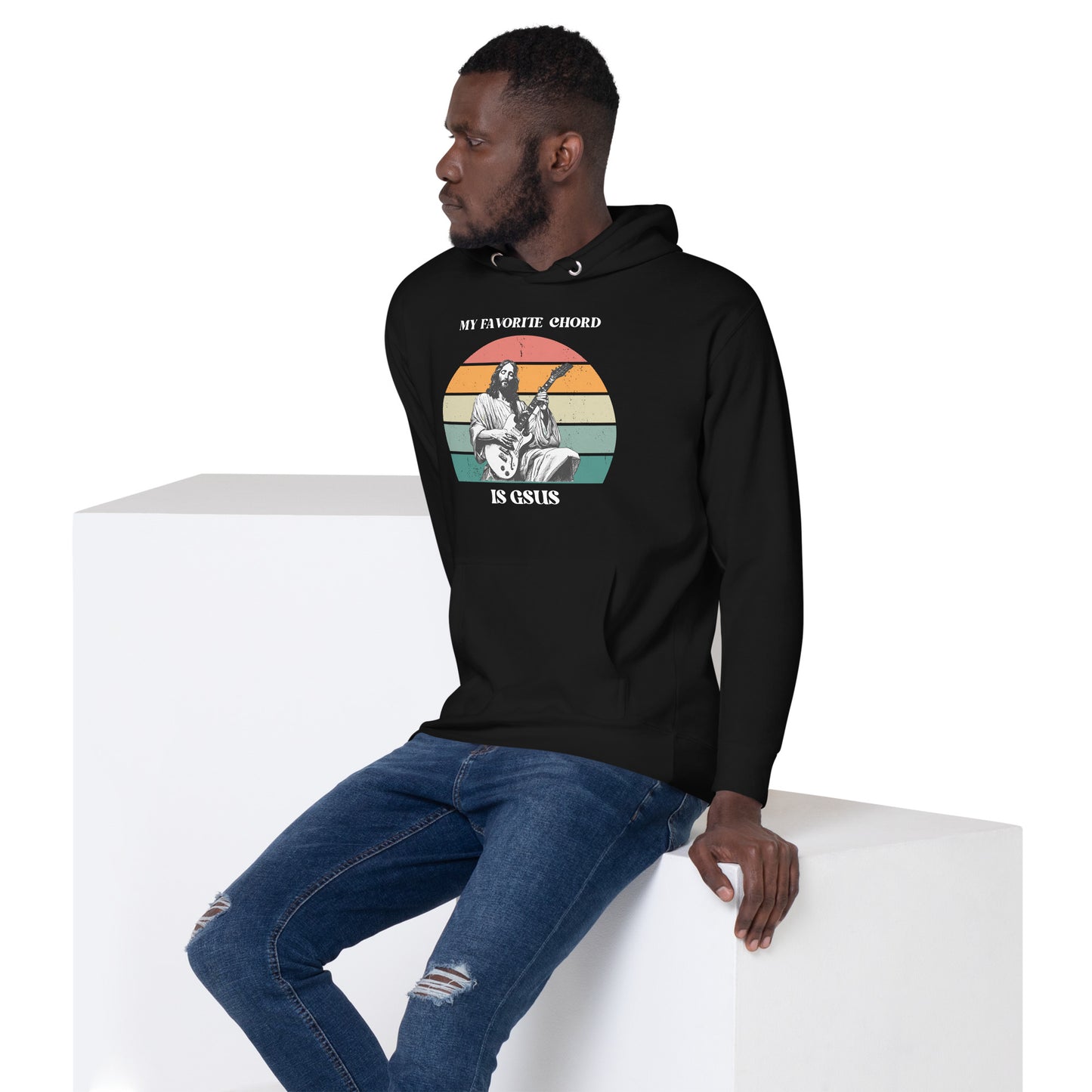 Side view of a plus-size adult in the “My Favorite Chord Is GSUS” hoodie, a soft and stylish pullover perfect for faith-based musicians. Featuring a three-panel hood, matching drawstrings, and a self-fabric back patch, this hoodie is available in sizes S to 3XL and delivers warmth and witty Christian humor.

