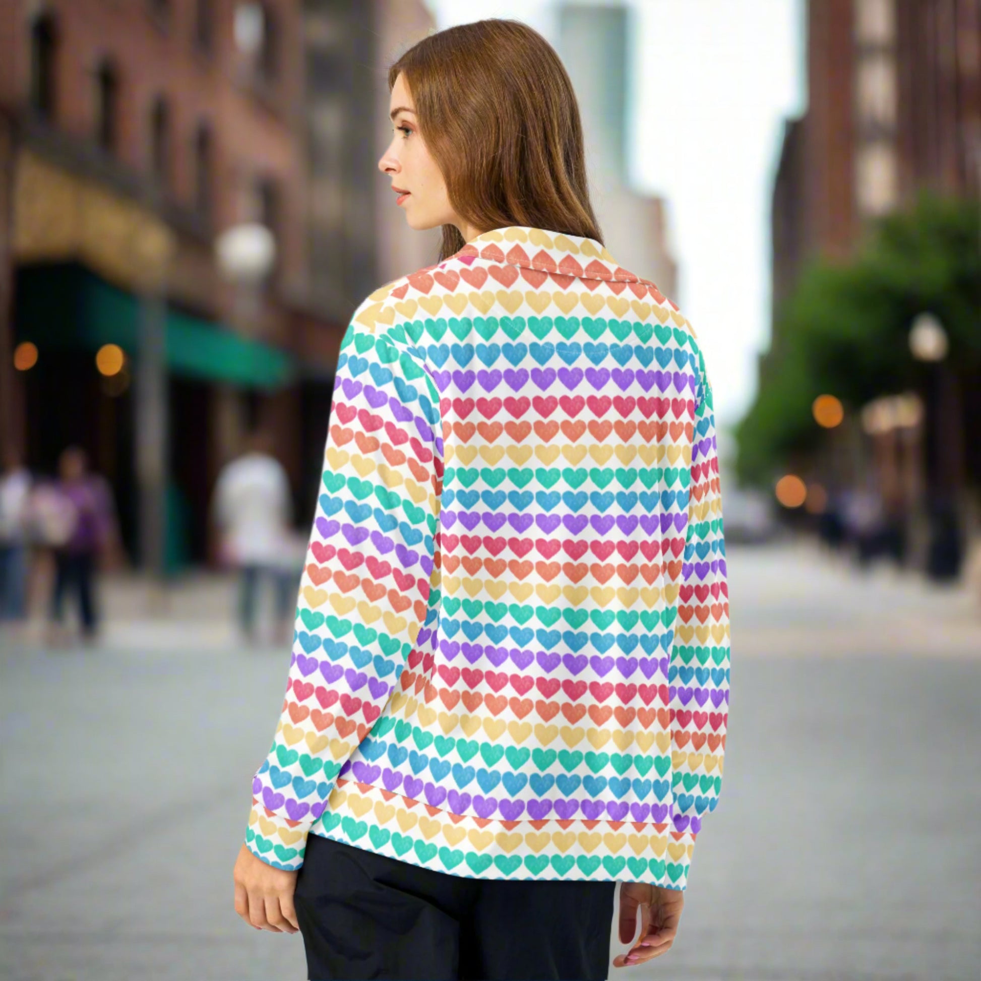 Designed for self-expression, this track jacket features a playful rainbow heart pattern on a clean white background. Available in unisex adult sizes 2XS–6XL, it's perfect for layering during Pride, music festivals, or everyday wear. Whether paired with the matching leggings or worn alone, it radiates joy, love, and style.