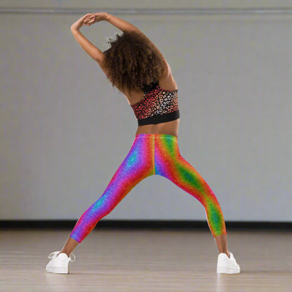 Rainbow swirl leggings for girls sizes 2T–7 with a holographic faux glitter look. Designed for toddlers and little girls who love bold colors, these stretchy leggings are comfy, stylish, and perfect for matching with older siblings or mom at Pride, Mardi Gras, or family fun days. A joyful wardrobe essential for colorful kids.