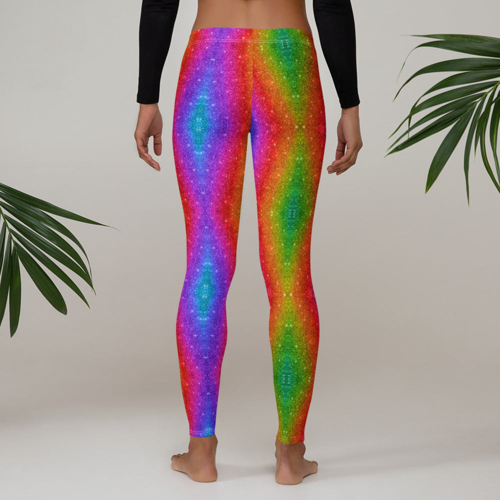 Women's activewear leggings with holographic rainbow glitter swirl print, designed for bold fashion moments at Pride, parades, or fitness events. These eye-catching leggings are full-length with a mid-rise waist, made of soft and stretchy microfiber fabric. Also available in toddler and youth sizes for fun family matching sets perfect for festivals, races, or just spreading joy.