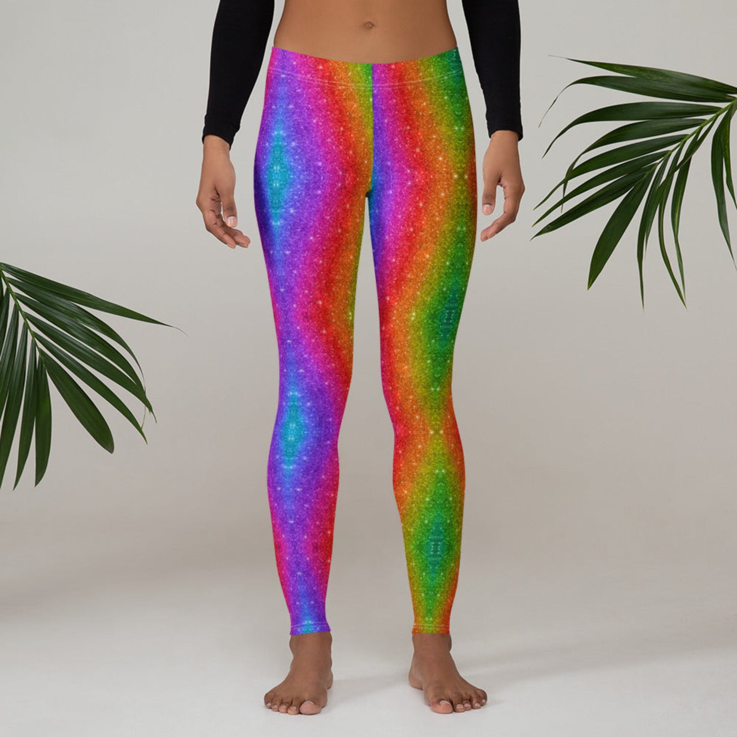 Rainbow holographic swirl leggings for women, made for Mardi Gras, Pride festivals, or expressive daily fashion. The bold, glitter-inspired design is printed on soft microfiber with a comfortable fit and four-way stretch. These leggings are breathable, UPF 50+, and versatile enough for events, workouts, or lounging. Available in matching toddler and youth sizes for a complete family set.