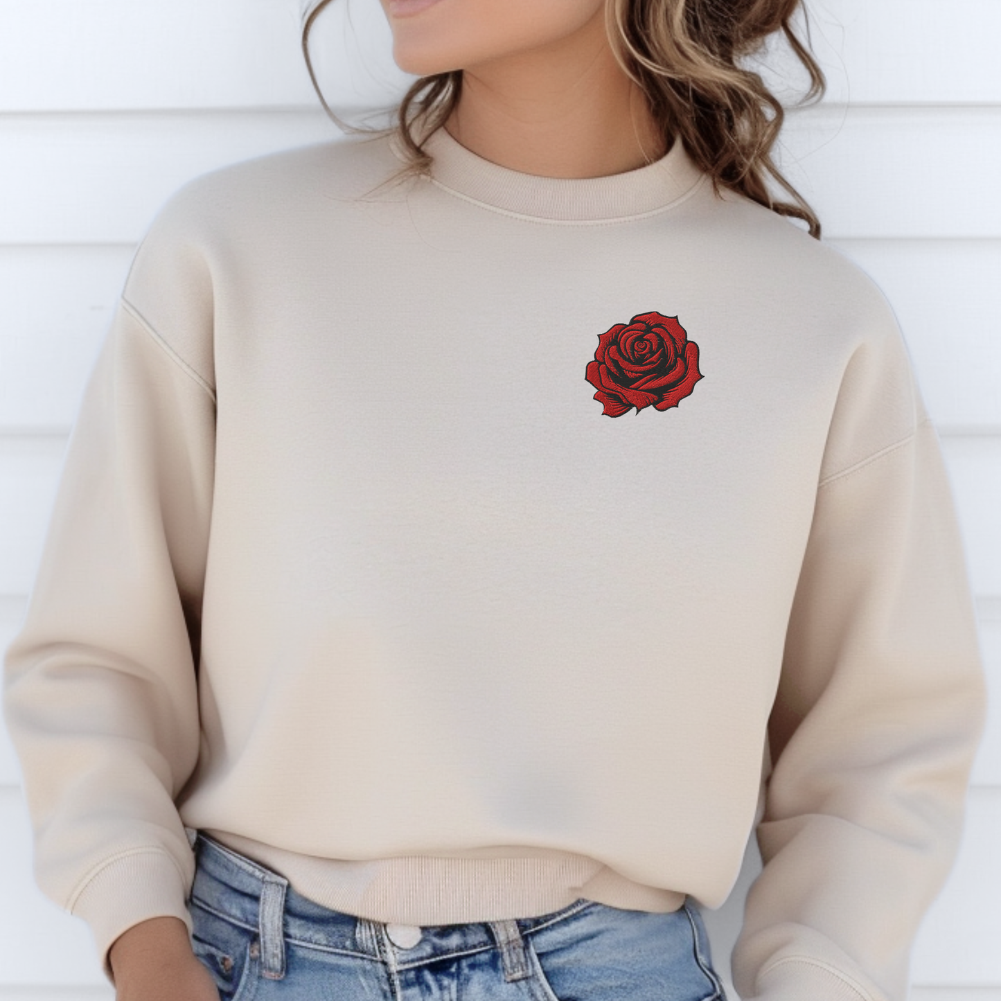 Close up of red rose embroidery on a Sand women’s sweatshirt, showing detailed stitching and soft cotton polyester texture. This embroidered floral sweatshirt combines traditional tattoo-inspired design with cozy oversized fit, making it ideal for romantic gifts or casual everyday style.