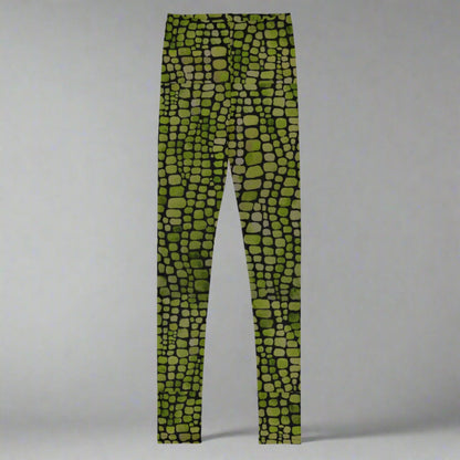 Reptile print youth girls leggings, size 8-20. These green yoga pants have a black reptile print pattern. These tights are available in plus/ extended sizes, and are perfect for casual wear, cosplay, Halloween Trick or treating or yoga class. Similar to a snake, lizard or dinosaur print, by jaecrece