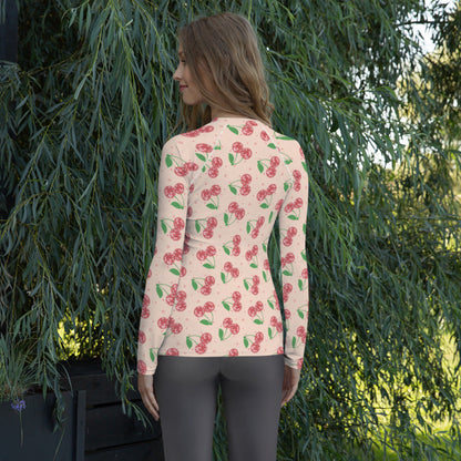 Colorful cherry print women’s swim shirt with a fun disco inspired pattern, fitted long sleeve design, and soft stretch fabric made for comfortable beachwear, water sports, vacations, and summer activities.