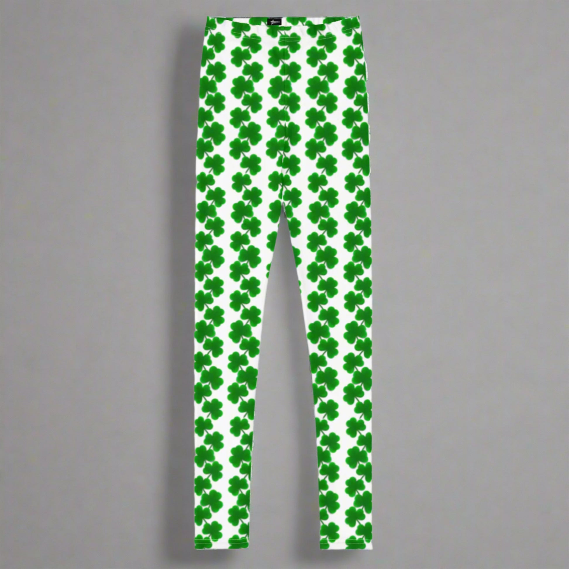 Image: St Patricks Day Shamrock Leggings in Tween and Teen Girls Sizes 8, 10, 12, 14, 16, 18, 20. Youth St. Patrick’s Day leggings for girls, available in sizes 8–20, feature a white base with vertical chains of bright green shamrocks. These holiday-themed leggings are soft, stretchy, and stylish—perfect for twirling at parties, attending school events, or joining in Irish-themed fun with family. A festive choice for any girl who loves cheerful, seasonal clothes.