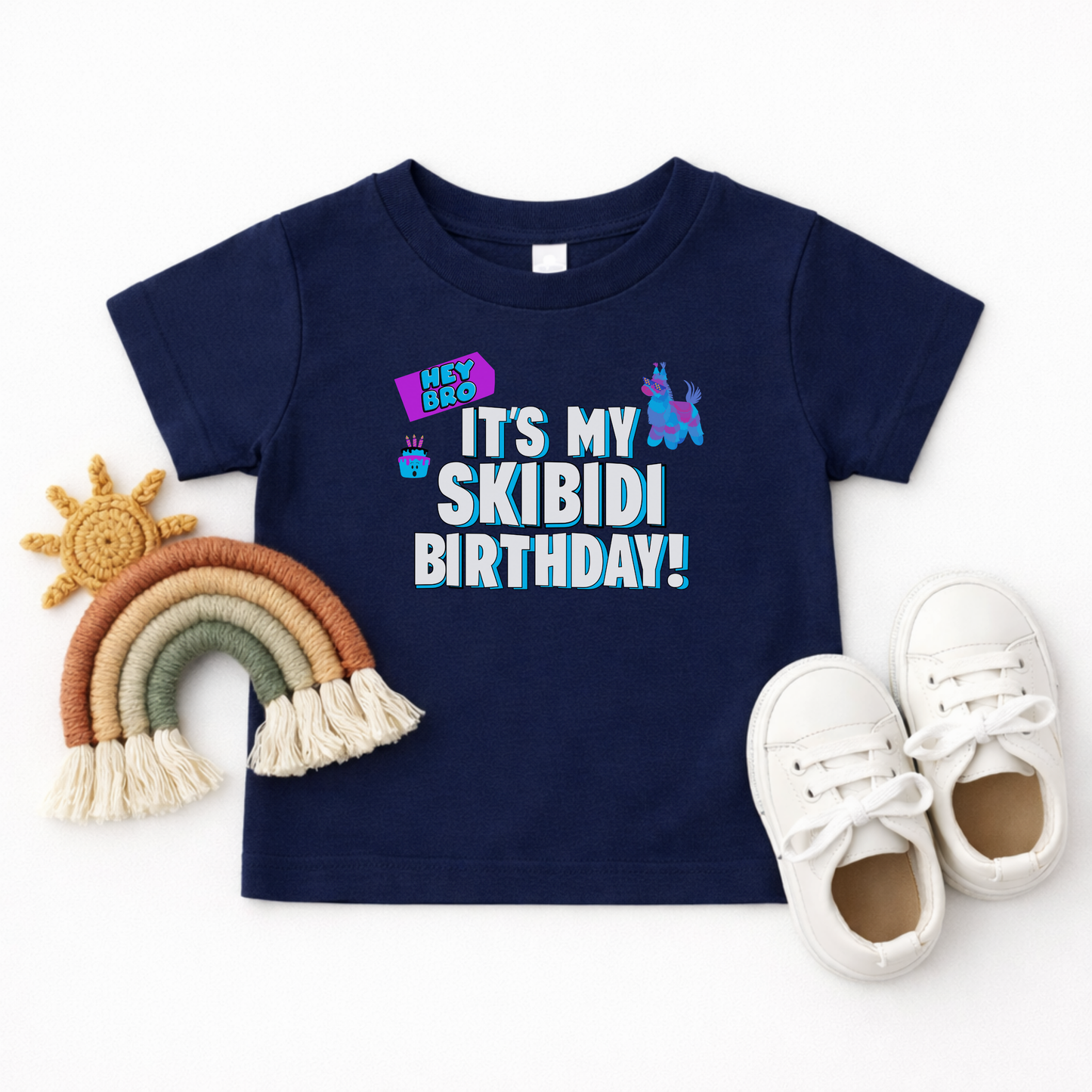 Skibidi themed birthday shirt for toddlers featuring the Hey Bro It’s My Skibidi Birthday message with bright colorful graphics and bold blue and white lettering, perfect for birthday parties and photos