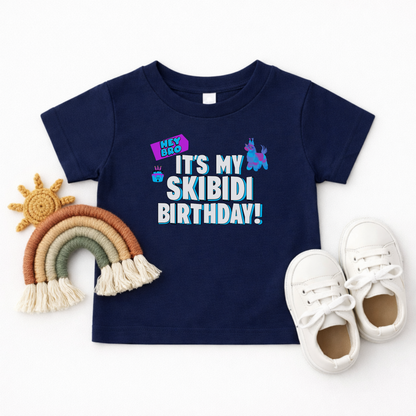 Skibidi themed birthday shirt for toddlers featuring the Hey Bro It’s My Skibidi Birthday message with bright colorful graphics and bold blue and white lettering, perfect for birthday parties and photos
