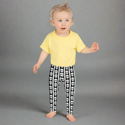 Image: These striped skull leggings for toddlers and kids offer spooky style in a comfy package. The bold black and white stripes give circus vibes while skull details add a fun Halloween touch. Whether paired with a tee or layered under a costume, they’re perfect for themed playdates or festive family photos. Available in multiple child and toddler sizes, by jaecrece.