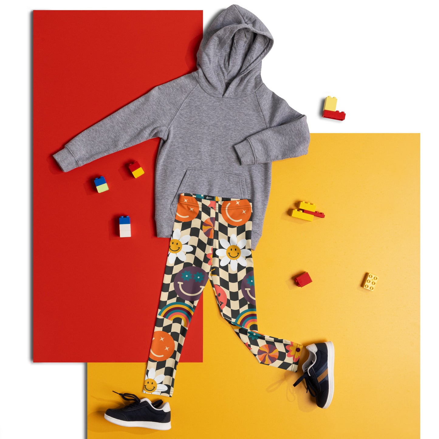 Fun and trendy, these Smiley Face Checkerboard Girls Leggings in toddler and little girl sizes 2T–7 feature a bold wavy checkerboard print in beige and black, decorated with bright rainbows, daisies, and happy faces. Comfortable and durable, they’re perfect for play, school, or casual outfits. Matching youth and women’s leggings make them a wonderful choice for family photos, sister sets, or mommy-and-me styles.