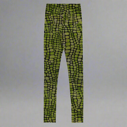 Reptile print youth girls leggings, size 8-20. These green yoga pants have a black reptile print pattern. These tights are available in plus/ extended sizes, and are perfect for casual wear, cosplay, Halloween Trick or treating or yoga class. Similar to a snake, lizard or dinosaur print, by jaecrece