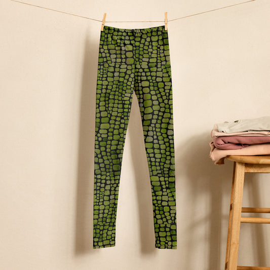 Green reptile print leggings for kids featuring a realistic scale pattern in vivid green and black. The high waist and full length design create a comfortable fit for movement, making these kids leggings suitable for play, dance, school outfits, activewear, and imaginative dress up. A fun costume base for a snake, dragon, dinosaur, lizard, or bearded dragon, with sizes 2T through 20.