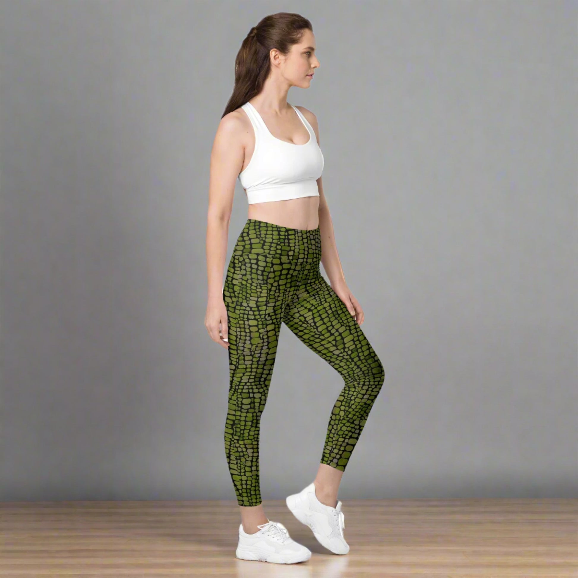 Reptile print ladies leggings. These green yoga pants have a black reptile print pattern. These tights are available in plus/ extended sizes, and are perfect for casual wear, cosplay, Halloween Trick or treating or yoga class. Similar to a snake, lizard or dinosaur print, by jaecrece