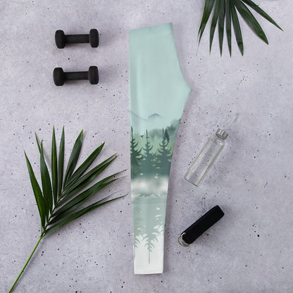These Winter Forest leggings showcase a serene watercolor mountain scene with soft blue and gray shades, snowy pine trees, and gentle fog drifting through the forest. The mountaincore and alpine inspired design makes them perfect for winter workouts, cozy cabin days, and nature themed outfits. Available in womens sizes and girls sizes for adorable mommy and me outdoor or holiday matching looks.