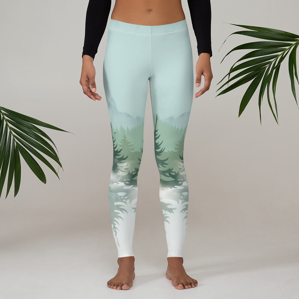 These leggings display a peaceful winter mountain scene with layered pine trees, drifting fog, and cool ombre coloring that blends forestcore and mountaincore aesthetics. Ideal for winter workouts, cabin weekends, and outdoor adventures. Womens sizes pair perfectly with matching girls sizes for sweet mommy and me outfits inspired by nature and snowy woodland views.