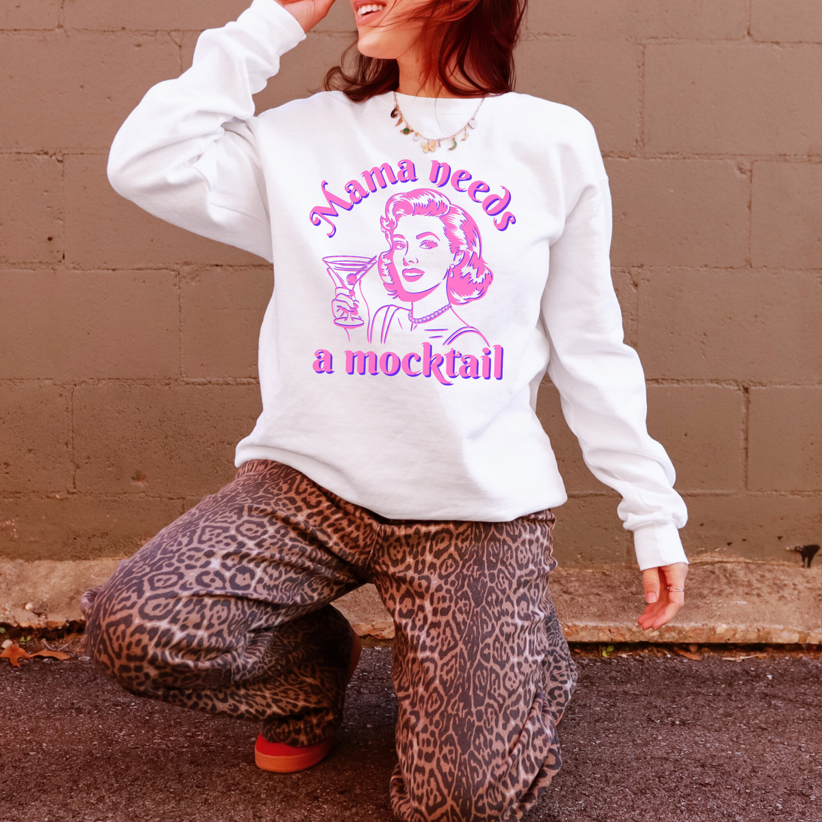 Comfort Colors sweatshirt featuring a colorful “Mama Needs a Mocktail” pop art graphic for women who enjoy alcohol free drinks. The retro inspired illustration of a woman holding a cocktail glass gives the design a playful vintage feel while the mocktail message keeps it lighthearted. This sweatshirt is a fun option for sober curious women, sober moms, designated drivers, mocktail enthusiasts, or anyone choosing to drink less alcohol.