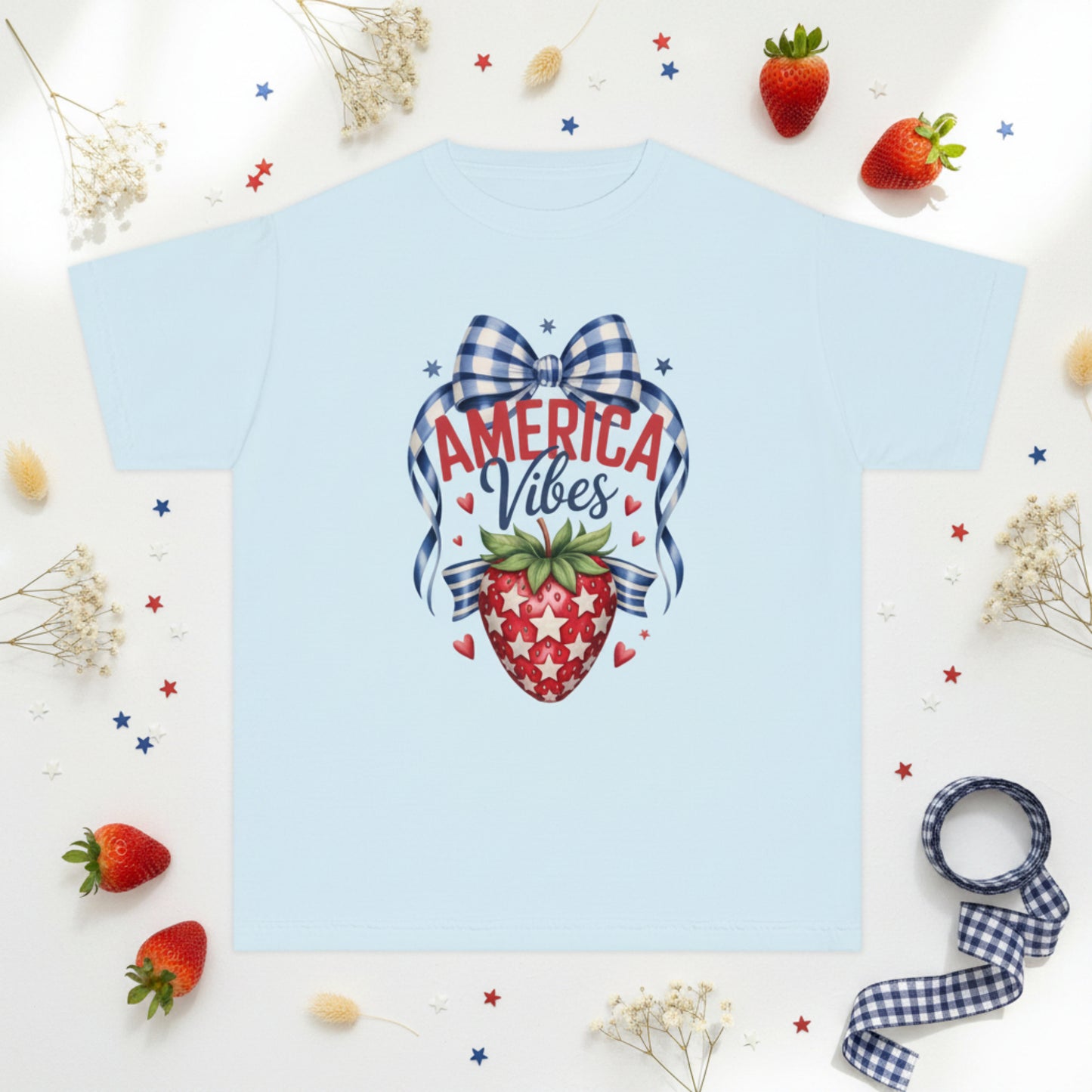 Soft Comfort Colors 9018 girls patriotic strawberry shirt inspired by vintage Americana and America 250 celebrations. Features strawberry artwork with gingham bow stars and heart accents on garment dyed cotton fabric. Relaxed fit youth tee perfect for 4th of July outfits mommy and me matching looks Memorial Day family gatherings patriotic vacations and summer holiday wear