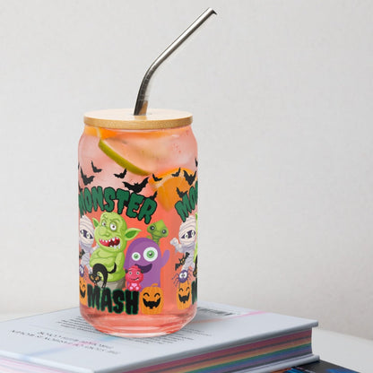 Celebrate spooky season with the Monster Mash 16 oz glass can, complete with bamboo lid and reusable straw. Playful design features colorful Halloween monsters, pumpkins, and bats for a festive touch. Perfect reusable iced coffee glass, cocktail cup, or soda tumbler for fall parties and gatherings. A fun seasonal gift for friends, family, or teachers. Trendy eco-friendly Halloween drinkware, durable festive glass sipper.