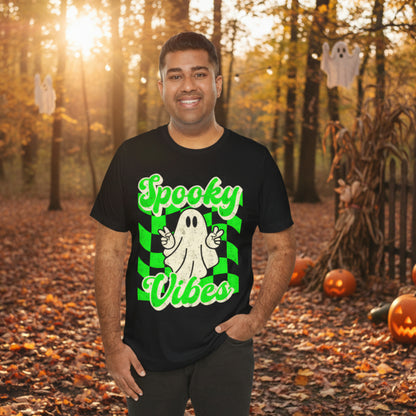 Spooky Vibes Halloween tee with cute ghost peace signs printed on a black Bella Canvas shirt and bright checkerboard background for a trendy retro look. Available in sizes S to 3XL with child sizes for matching family outfits. Great gift for ghost lovers, Halloween moms, teachers, party hosts, and teens who love playful spooky apparel, fall graphic tees, pumpkin patch style, October celebrations, and comfy everyday seasonal fashion.