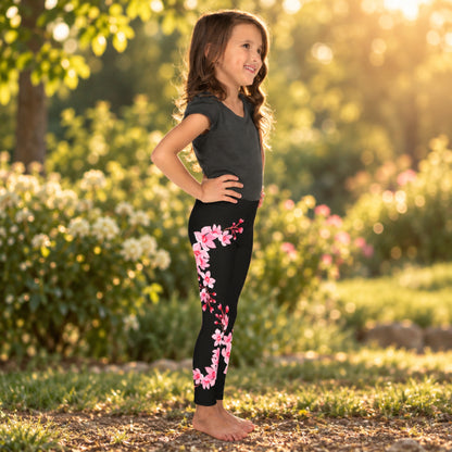 Black girls leggings decorated with pink cherry blossoms and sakura flowers, creating a spring inspired floral outfit for toddlers and young girls. The Japanese inspired design is a pretty choice for cherry blossom season, spring outfits, nature lovers, and everyday wear.