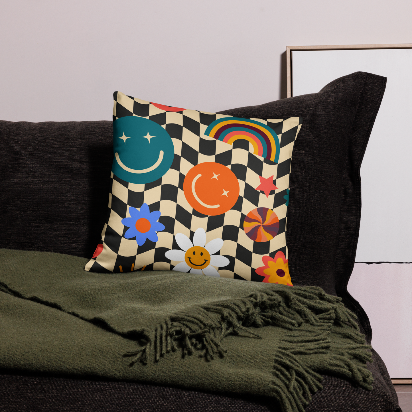 Square Y2K smiley face checkerboard throw pillow displayed on a sleek black couch, showing how the bold black and tan check pattern with bright smiley icons pops against dark furniture. Soft girl aesthetic and retro vibes make this decorative accent perfect for teen bedrooms, dorm rooms, or cozy apartments. Double-sided printed pillow adds cheerful personality, vibrant color, and comfort, making it a fun gift and stylish home décor update.