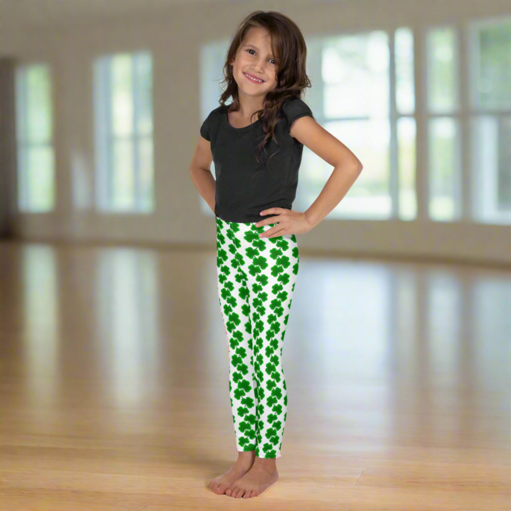 Image: St Patricks Day Leggings for toddlers and girls. These girls’ shamrock leggings, available in sizes 2T to 7, feature green clovers in vertical chains on a soft white background. Perfect for St. Patrick’s Day festivities, these full-length leggings with a high-rise fit offer comfort and cuteness for toddlers and little kids. Match them with mom or siblings for adorable March photo ops or holiday fun. Also available in tween girl and womens sizes for family matching outfits, by jaecrece