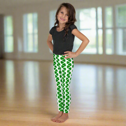 Image: St Patricks Day Leggings for toddlers and girls. These girls’ shamrock leggings, available in sizes 2T to 7, feature green clovers in vertical chains on a soft white background. Perfect for St. Patrick’s Day festivities, these full-length leggings with a high-rise fit offer comfort and cuteness for toddlers and little kids. Match them with mom or siblings for adorable March photo ops or holiday fun. Also available in tween girl and womens sizes for family matching outfits, by jaecrece