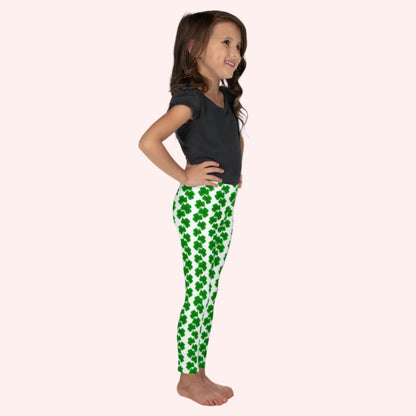 Image: St Patricks Day Leggings for toddlers and girls. Celebrate St. Patrick’s Day with these adorable girls’ leggings for toddlers and kids, featuring green shamrock chains on a bright white background. With a full-length fit and high-rise waistband, these leggings are comfy, festive, and fun. Designed to match with youth and women’s sizes for a cute and coordinated family outfit during March celebrations. Also available in tween girl and womens sizes for family matching outfits, by jaecrece