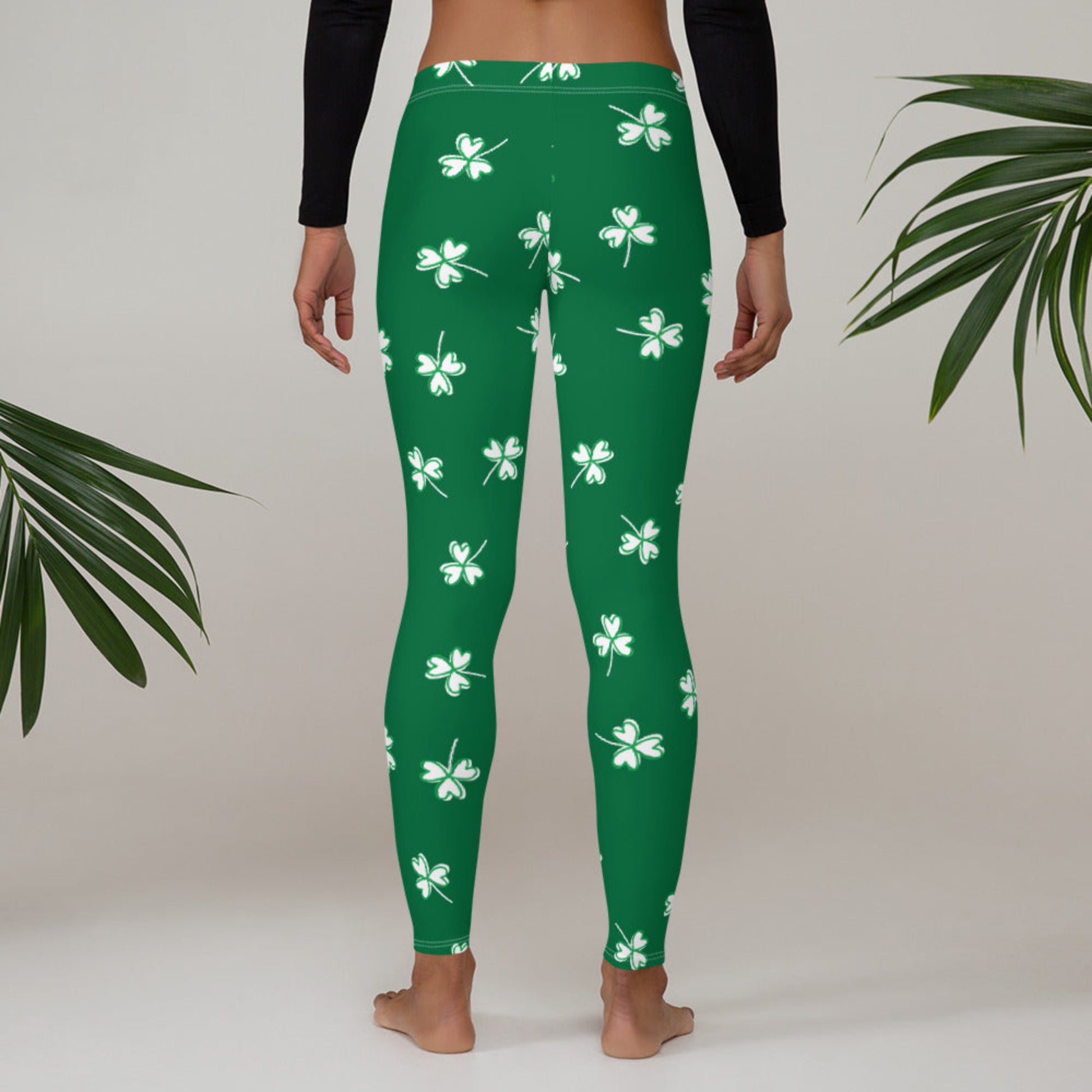 St. Patrick's Day leggings available in women's, toddler, girls, and tween sizes featuring a coordinated green and white shamrock pattern for matching family outfits