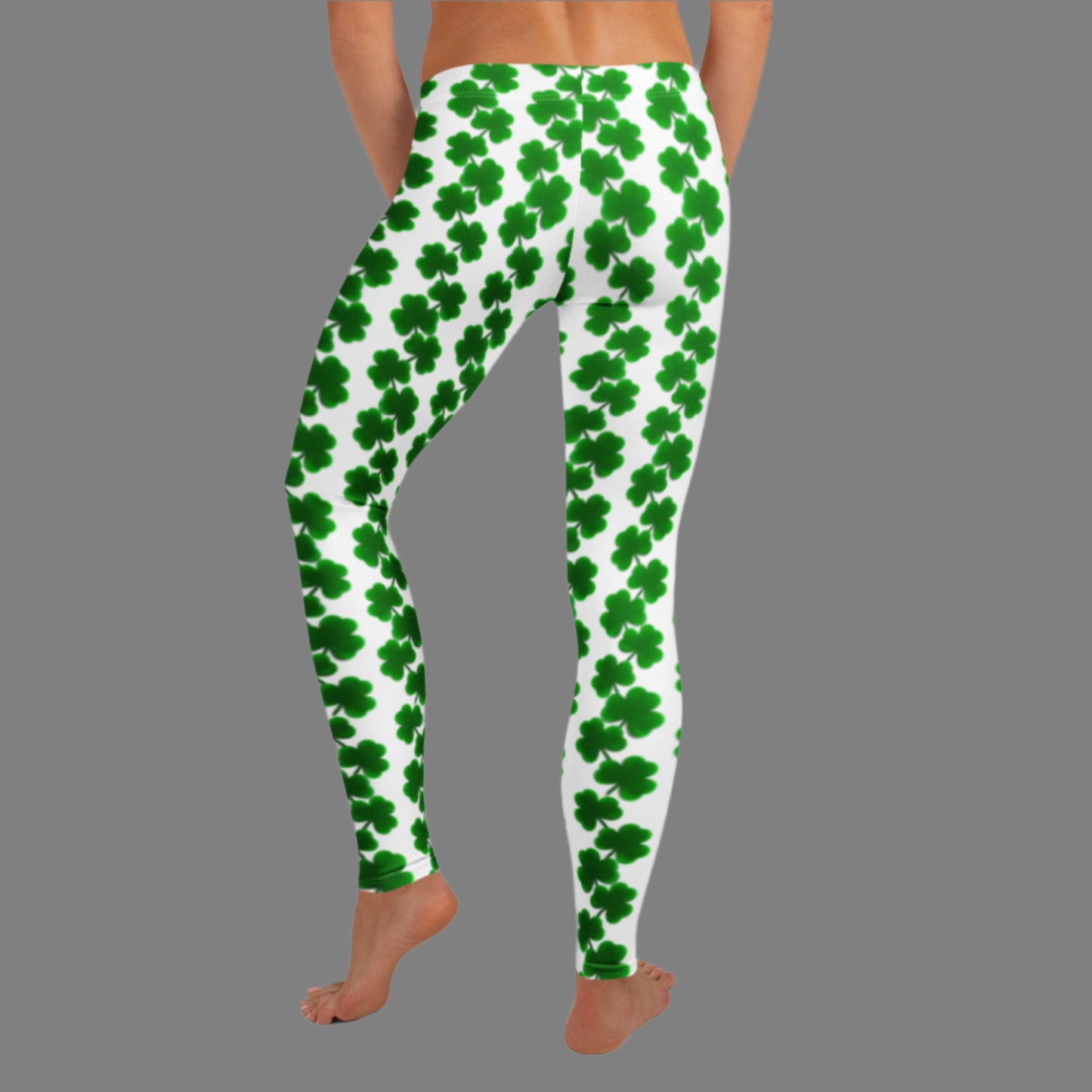 Image: St Patricks Day Leggings for toddler girls, tween, teens and women. These St. Patrick’s Day leggings for women offer a mid-rise waist, full-length legs, and green shamrocks cascading down a white background. Crafted with four-way stretch for easy movement, they’re comfy and festive—ideal for March parades, parties, or family matching outfits. Available in sizes XS to XL for women who want fun, playful Irish-themed athleisure wear.

