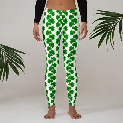Image: St Patricks Day Leggings for toddler girls, tween, teens and women. The yoga pants are white with a green shamrock pattern. These women’s St. Patrick’s Day leggings feature an all-over shamrock design on a white background with a mid-rise waistband and full-length legs. Designed for comfort and flexibility, they’re ideal for festive holiday looks, casual wear, or matching with kids for a coordinated family outfit. Available in sizes XS to XL, these fun leggings are perfect for celebrating in style.