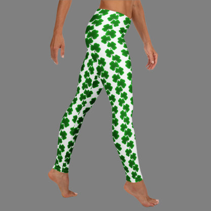 Image: St Patricks Day Leggings for women. These yoga pants are white with a green shamrock pattern. These shamrock print leggings for women feature a mid-rise waist and full-length fit, making them perfect for St. Patrick’s Day celebrations or cozy wear any time. The white background is accented with bright green shamrocks in a repeating chain pattern. Great for Irish-themed parties, March family photos, or matching with kids’ leggings for a mom-and-me holiday outfit.

