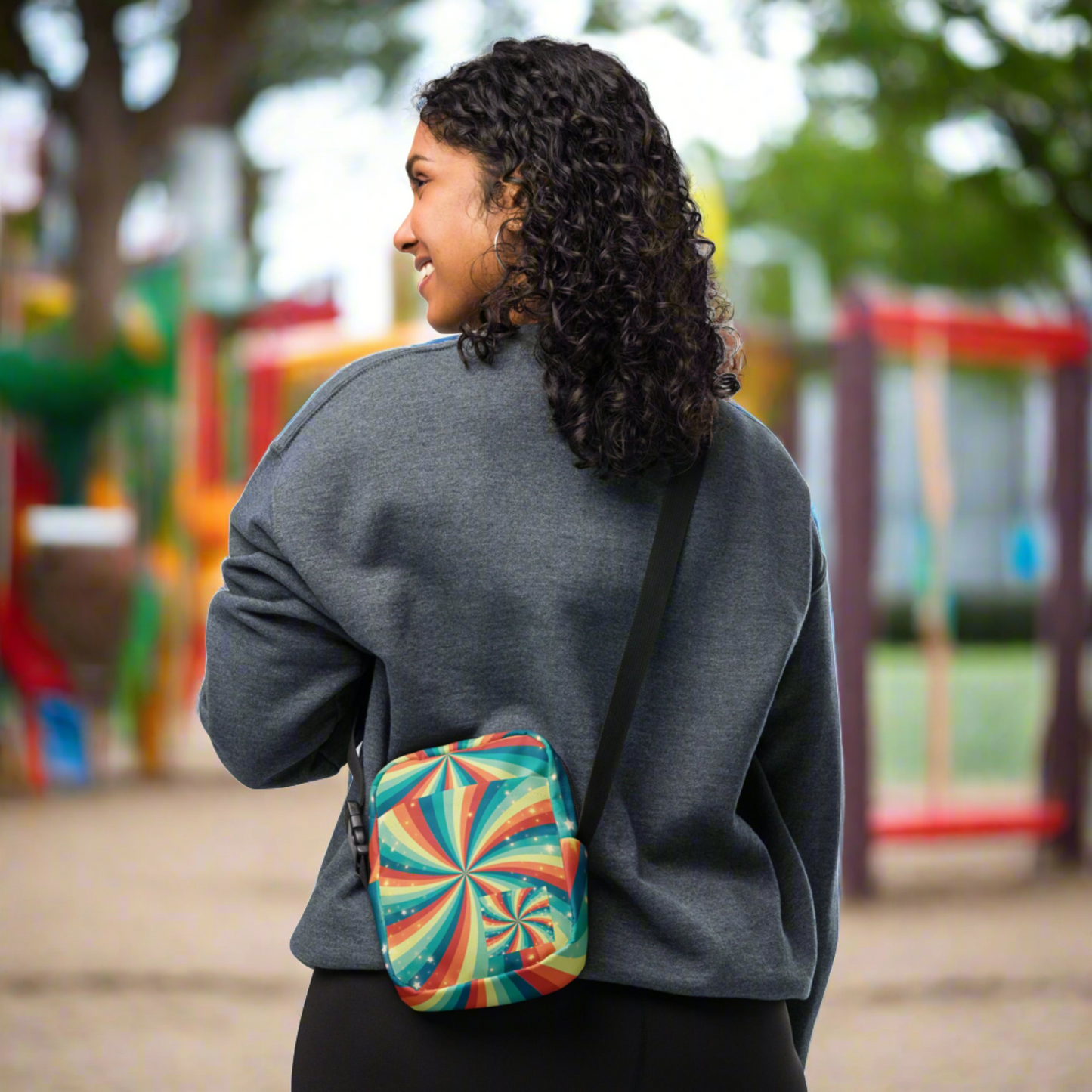 Stars and rainbow swirls utility crossbody bag with a bold colorful celestial pattern on durable canvas style fabric. This compact everyday bag includes inside and outside pockets, a sturdy zipper, and an adjustable shoulder strap for comfortable wear. Ideal for travel, festivals, concerts, shopping trips, and everyday errands. A vibrant rainbow aesthetic crossbody bag designed to carry essentials like phone, wallet, and small personal items.