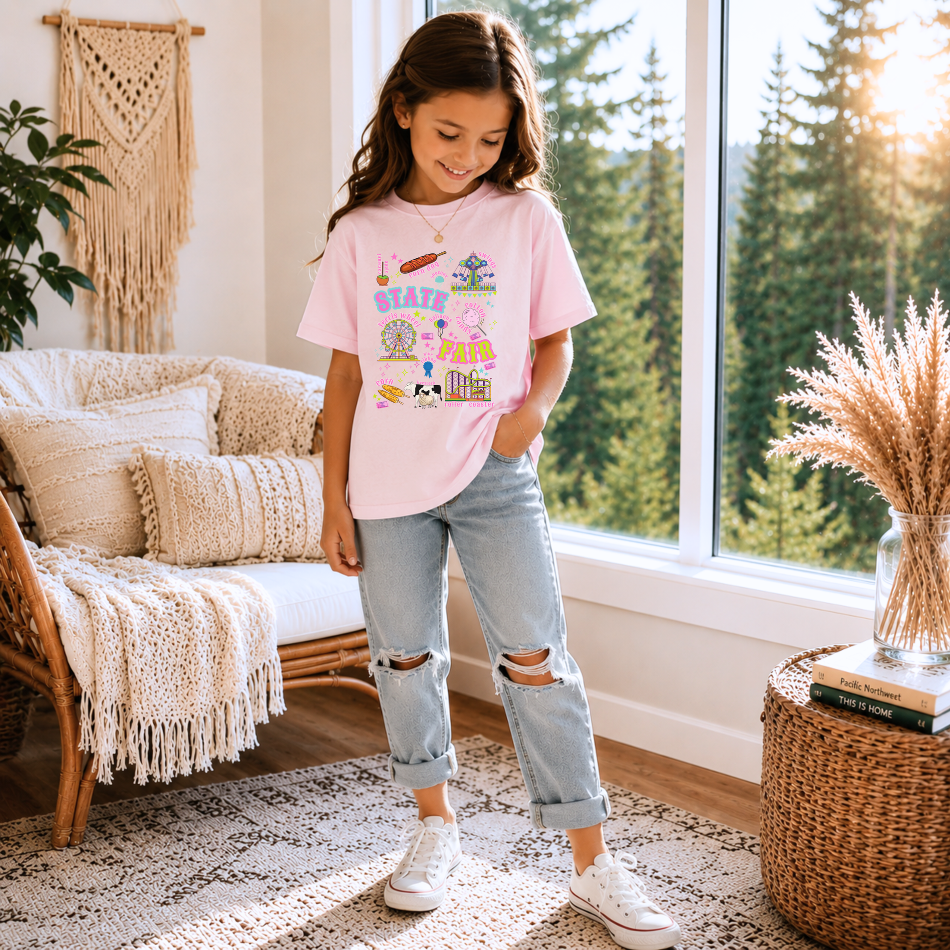 Kids State Fair shirt in a retro Americana style featuring colorful Ferris wheel and roller coaster artwork along with cotton candy, funnel cake, corn dogs, balloons, livestock, blue ribbon and fair tickets. Bright pink, aqua, lime, orange and purple details create a cheerful summer graphic for fair season.