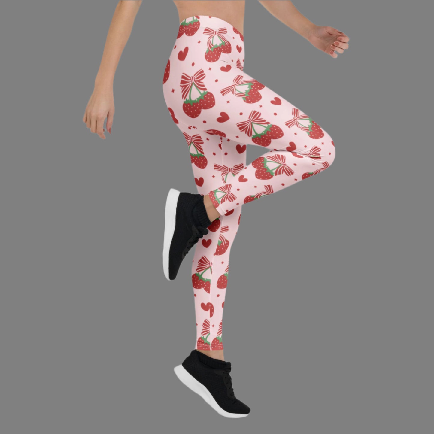 Image: These pink leggings for women feature an allover strawberry and bow design that blends whimsy with a trendy coquette vibe. Available in sizes XS through XL, they offer a flattering fit and all-day comfort for lounging, light workouts, or styled looks. Perfect for gifting or everyday wear, these leggings are a sweet choice for women who love playful and pretty prints, by jaecrece.

