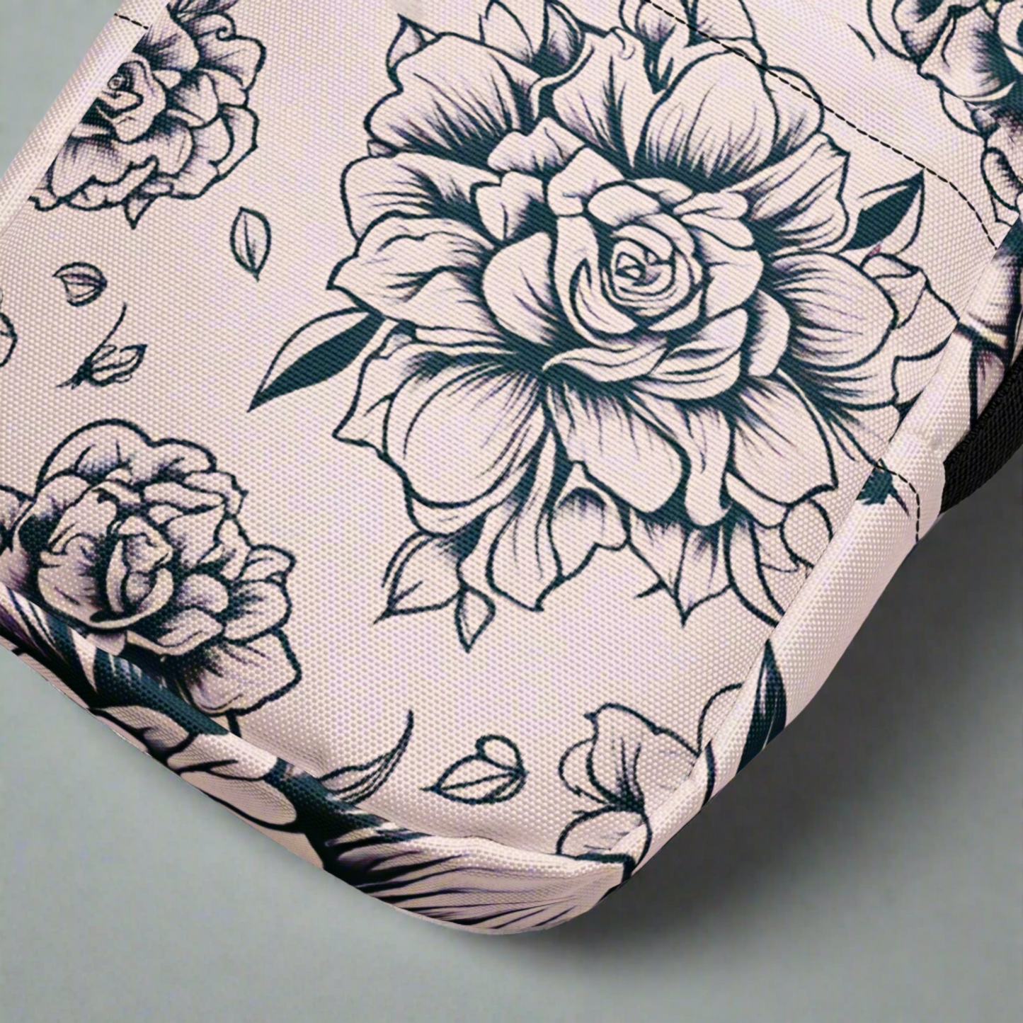 Stylish pink tattoo rose crossbody bag with durable polyester fabric, perfect as a compact festival purse, daily organizer bag, or trendy women’s travel crossbody. Features include water-resistant finish, multiple compartments inside and outside, adjustable strap for comfort, and smooth two-way zipper. This unique tattoo floral print handbag combines edgy alternative fashion with everyday functionality for versatile wear.