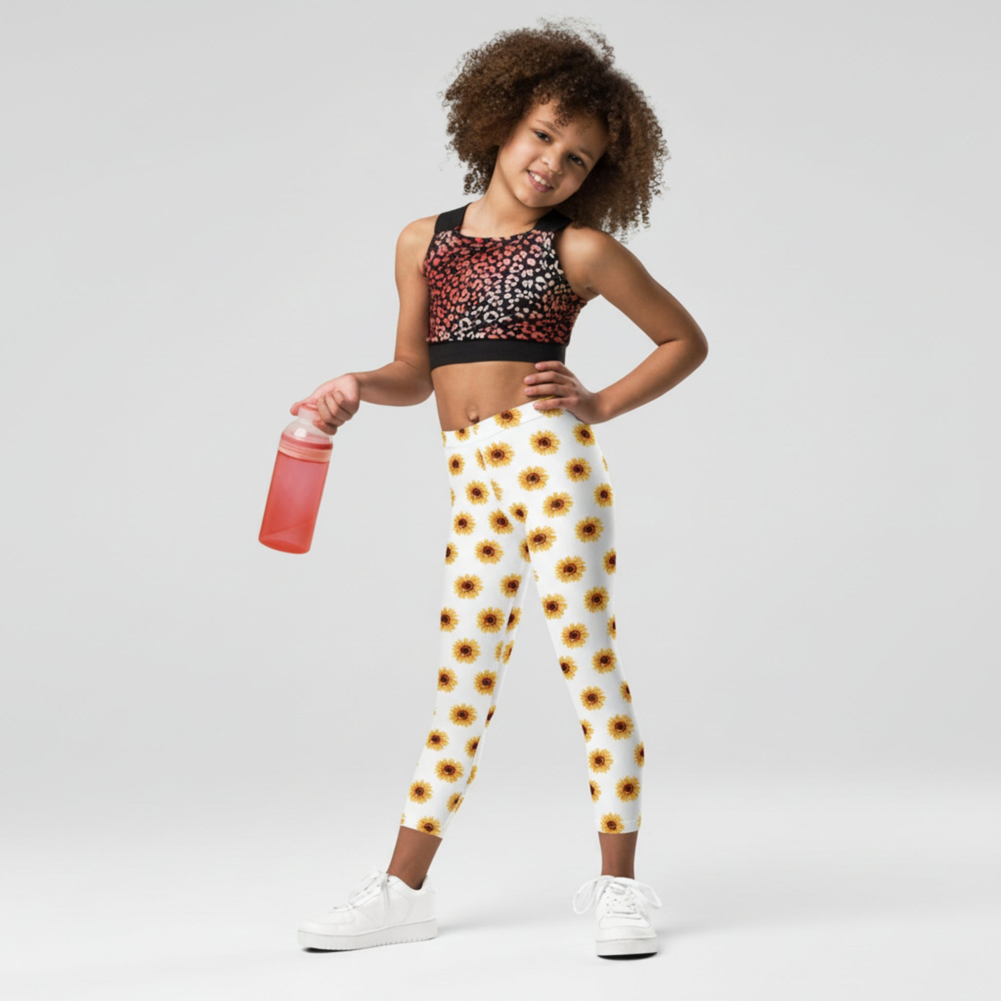 Capture sunshine and smiles with these toddler sunflower leggings for girls. The soft white background and bright yellow flowers create a joyful, boutique-style look. Crafted from smooth microfiber, these full-length leggings are designed to move with your child through playtime and adventures. Fade-resistant, handmade, and made to order for sustainability, they also come in youth and women’s sizes for matching family moments.