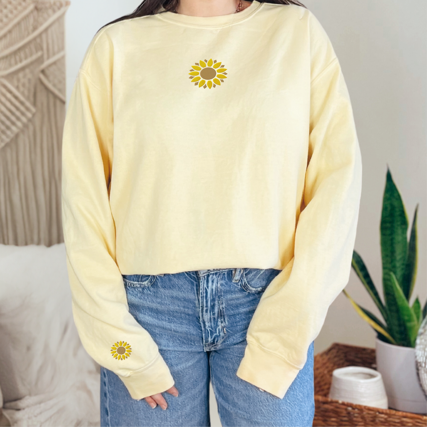 Comfort Colors sunflower sweatshirt displayed as a floral embroidered crewneck with matching sunflower details on the chest and sleeve. The relaxed fit and garment dyed finish create a casual everyday look that pairs easily with jeans, leggings, shorts, or joggers. A beautiful gift idea for birthdays, Mother’s Day, teacher appreciation, gardening enthusiasts, and nature lovers.