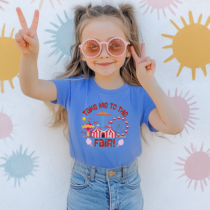 Cute Take Me To The Fair graphic shirt featuring colorful carnival rides, Ferris wheel, cotton candy, striped fair tent, and retro inspired fair artwork.