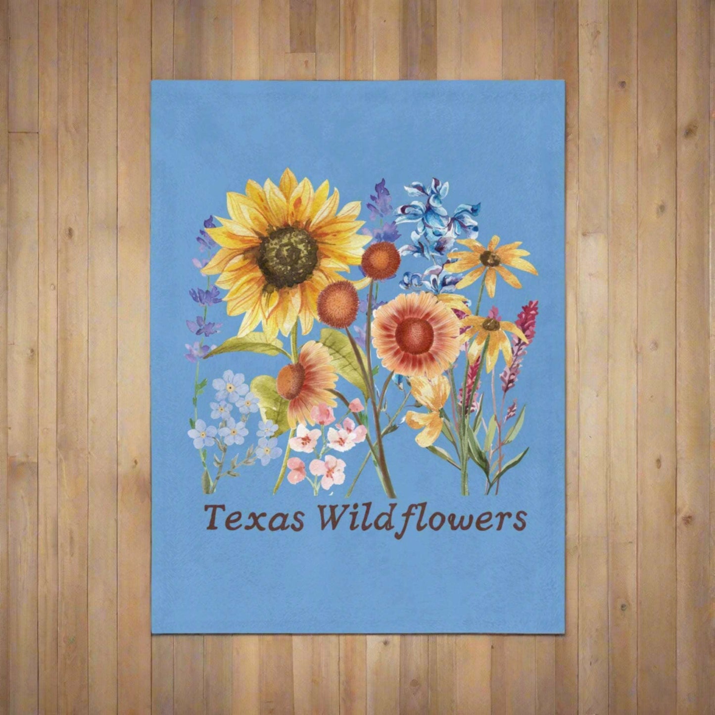 This Texas Wildflowers Plush Blanket features a soft watercolor print of bluebonnets, Indian paintbrush, and sunflowers. The cozy floral blanket adds rustic charm to a nursery, couch, or bedroom. Designed for Texas lovers and wildflower fans, this light blue throw is a warm and beautiful gift for moms, gardeners, or anyone who enjoys state flower decor, boho home accents, or spring-inspired southern style.