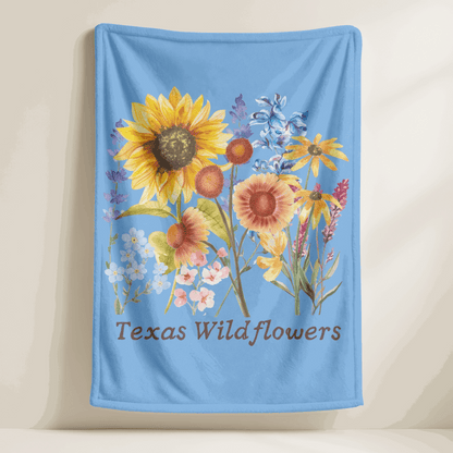 This Texas floral throw blanket showcases a charming wildflower print with watercolor bluebonnets, sunflowers, and delicate pastel greenery. Ideal for spring home decor, baby gifts, or cozying up on the couch, this plush blanket celebrates Texas nature and southern charm. It's a soft and snuggly gift for moms, gardeners, and fans of wildflower or botanical print home accents.

