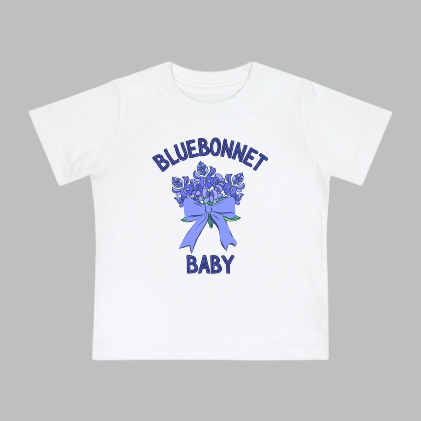 Image: This cute toddler t-shirt features a stunning bluebonnet design, making it a great outfit for spring adventures. The breathable cotton fabric ensures comfort for all-day wear at family gatherings, nature walks, or Easter celebrations. Designed with Texas pride in mind, it’s a must-have for parents who love their state’s wildflowers. A perfect baby shower gift or birthday present for Texas-born little ones, this tee is a springtime favorite, by jaecrece.