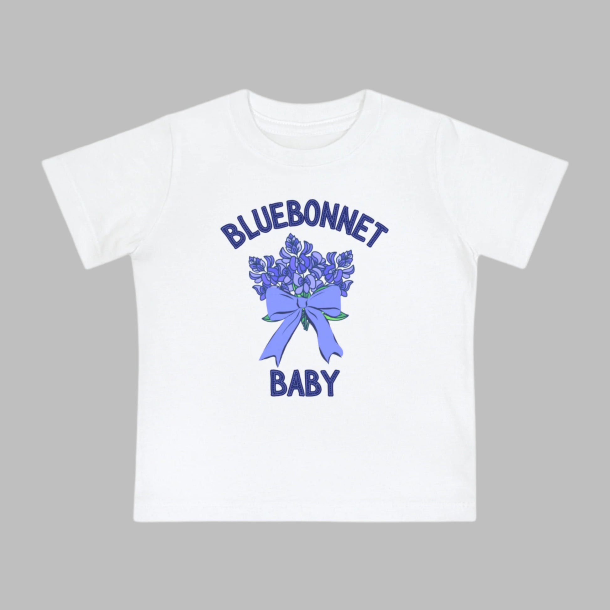 Image: This cute toddler t-shirt features a stunning bluebonnet design, making it a great outfit for spring adventures. The breathable cotton fabric ensures comfort for all-day wear at family gatherings, nature walks, or Easter celebrations. Designed with Texas pride in mind, it’s a must-have for parents who love their state’s wildflowers. A perfect baby shower gift or birthday present for Texas-born little ones, this tee is a springtime favorite, by jaecrece.