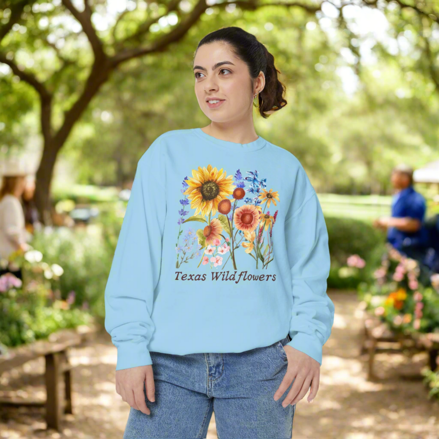 Texas wildflower print sweatshirt with cozy fleece feel and vintage floral artwork. This springtime staple features native blooms like bluebonnets and Indian paintbrush, perfect for Southern girls who love scenic drives and nature trails. Pairs beautifully with jeans or leggings for a casual, charming Texas inspired outfit that’s equal parts comfortable and cute.