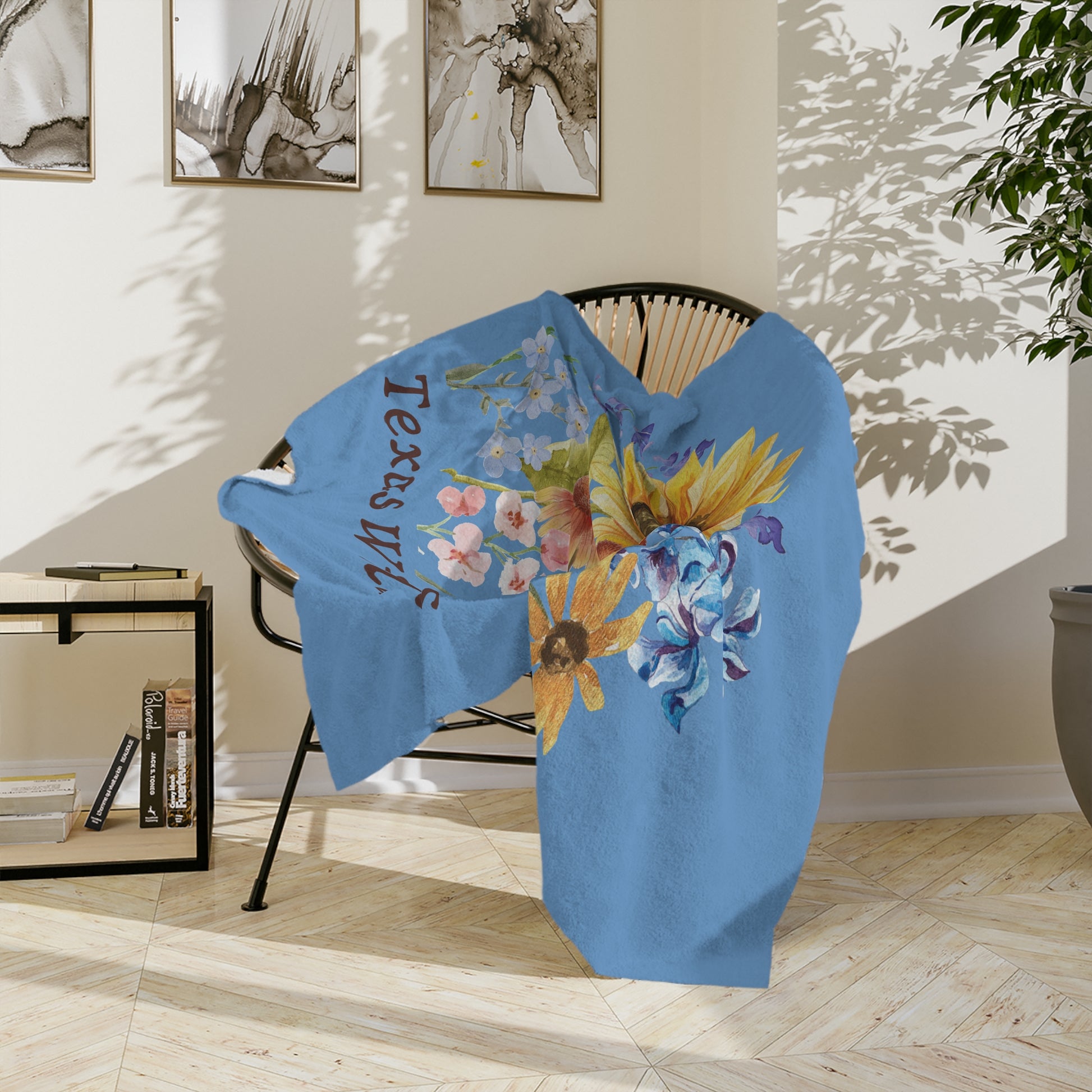 This floral plush throw blanket features watercolor Texas wildflowers including bluebonnets, Indian paintbrush, and sunflowers. A perfect southern decor piece, this soft throw adds warmth to bedrooms, nurseries, or living rooms. Great as a Mother's Day gift, garden lover present, or pastel accent blanket, it combines rustic charm with cozy comfort for any Texas-themed space.