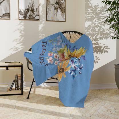 This floral plush throw blanket features watercolor Texas wildflowers including bluebonnets, Indian paintbrush, and sunflowers. A perfect southern decor piece, this soft throw adds warmth to bedrooms, nurseries, or living rooms. Great as a Mother's Day gift, garden lover present, or pastel accent blanket, it combines rustic charm with cozy comfort for any Texas-themed space.