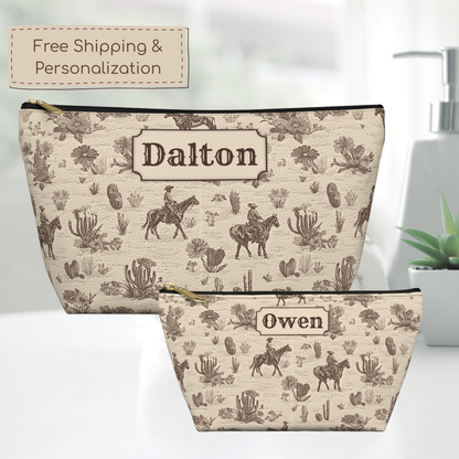 Custom name Western toiletry bag featuring a sophisticated vintage cowboy pattern in sepia brown and cream. The detailed toile design includes riders on horseback, desert plants and cacti. A structured T bottom and secure zipper make this personalized travel pouch practical for toiletries, cosmetics, grooming supplies and accessories.