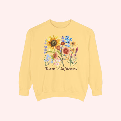 Comfortable floral Texas sweatshirt printed with native blooms like bluebonnets and Indian paintbrush on a classic crewneck. This soft fleece top offers relaxed, cozy style inspired by Texas wildflower season. Designed for nature loving mamas, flower enthusiasts, and fans of cottagecore and boho aesthetics. A great gift for spring birthdays, road trip partners, or garden lovers.
